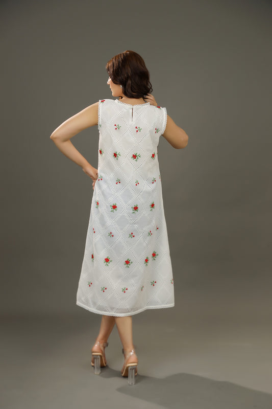 Woman wearing a white dress with floral patterns Organic-_cotton-white-summer-woman-dress-red-floral-backside