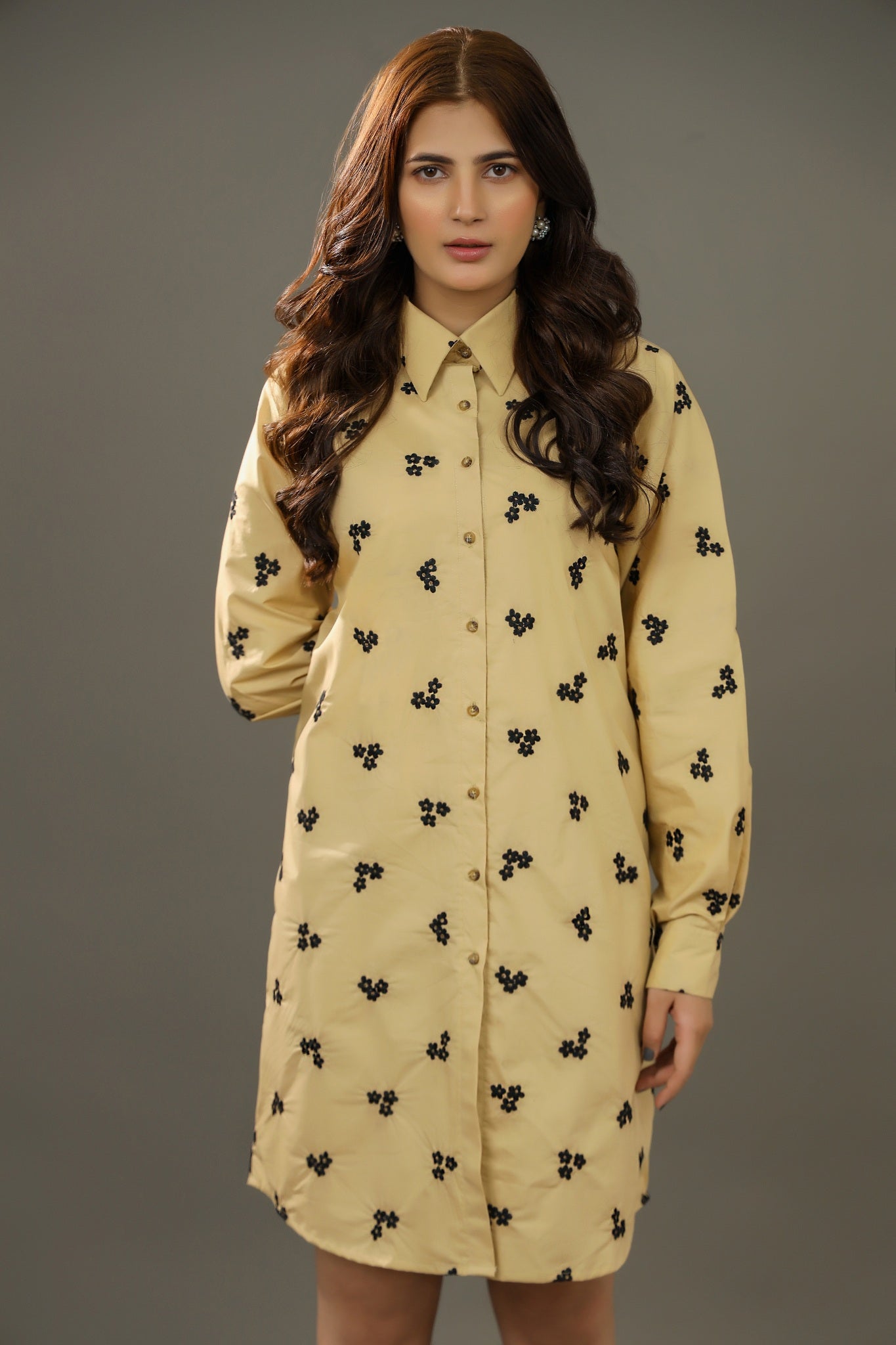 Woman wearing a beige dress with blue floral patterns against a gray backgroundPremium-organic-cotton-summer-woman-top-floral--embroidery-fullsleeve-shirtdress front