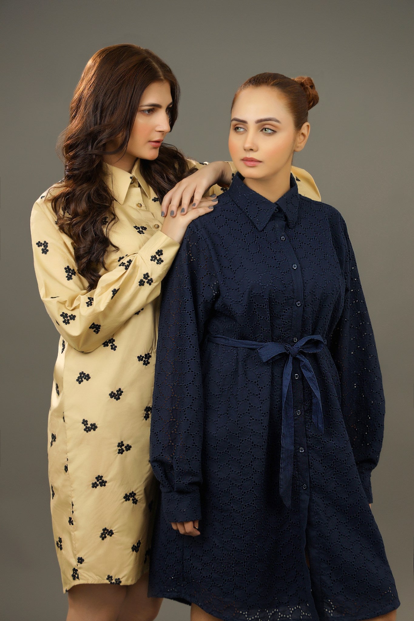 Two women wearing long dresses against a gray background Premium-organic-cotton-summer-woman-top-floral-embroidery-fullsleeve-shirtdress-sideview