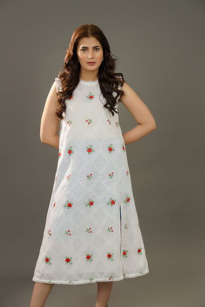 Woman wearing a white dress with floral patterns Organic-_cotton-white-summer-woman-dress-red-floral-frontside