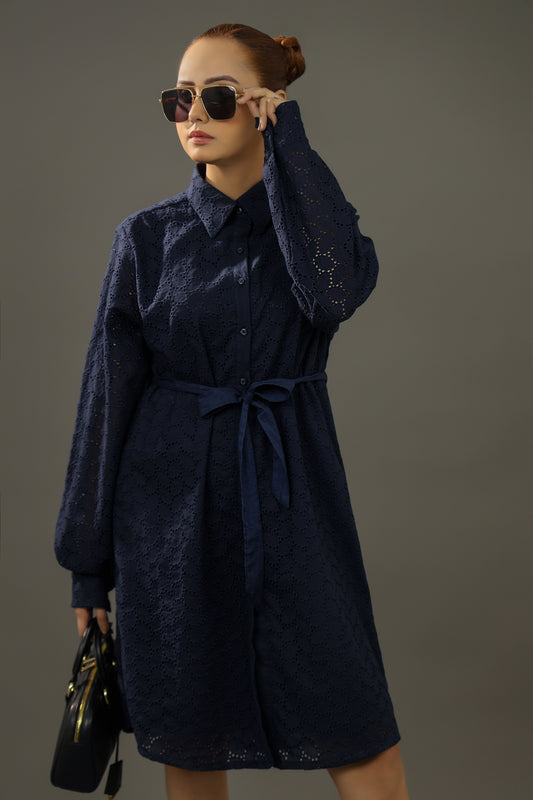 Woman wearing a navy blue dress with a belt against a gray background,Premium-organic-cotton-summer-woman-top-floral-embroidery-fullsleeve-shirtdress-front-closeup