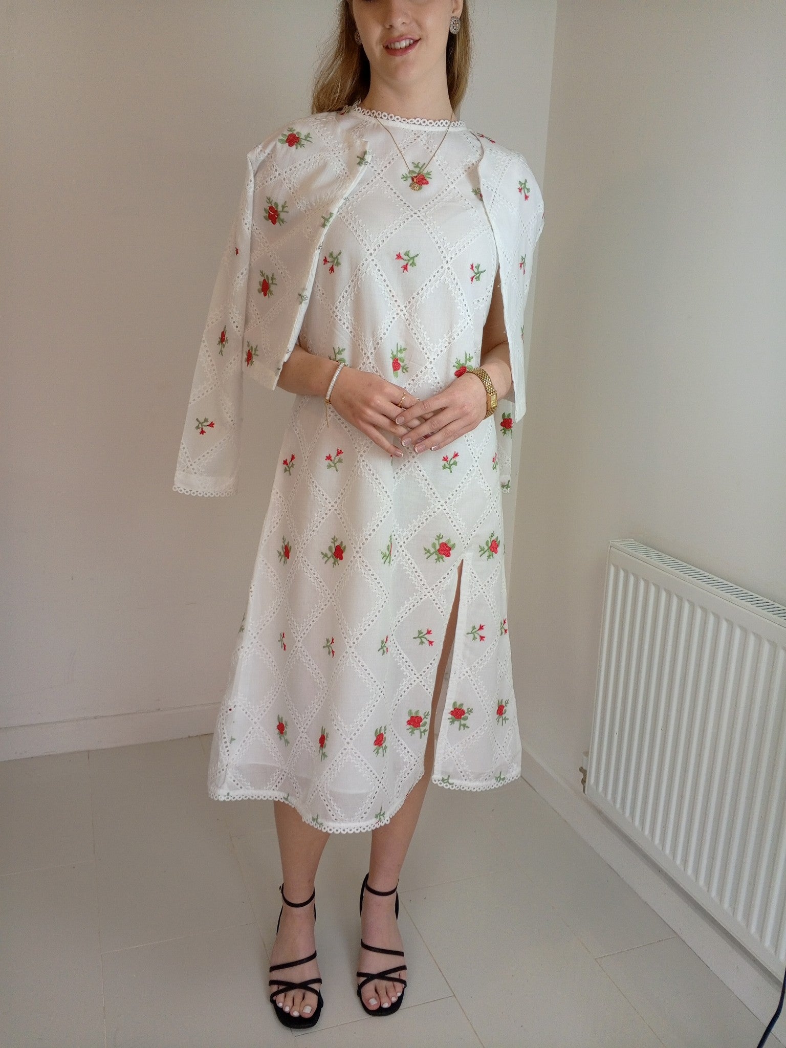 Woman wearing a white floral dress with a slit,Premium-organic-cotton-summer-woman-top-floral-red-embroidery-fullsleeve-matching  jacket with dress
